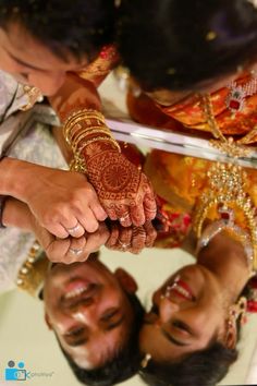 the bride and groom are holding hands together