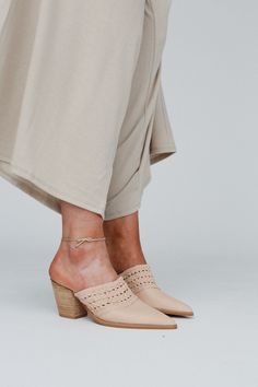 These timeless mules are the perfect touch to any outfit, the Downtown Days Chunky Heel Mule is a must - have for every boho gal! From shopping days to a getaway you'll want to take them everywhere becasue they feature: Pretty vegan leather woven fabric along the top So good slip - on mule style Cute pointed toe detail Perfect 3" thick heel *Due to lighting and differences in monitors, actual colors may vary slightly from what appears online. Approximate measurements are as follows: Width: 3 1/2