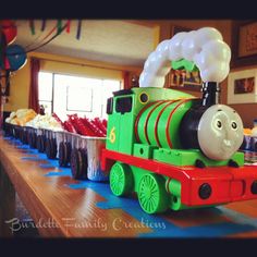 a thomas the tank engine birthday party with balloons