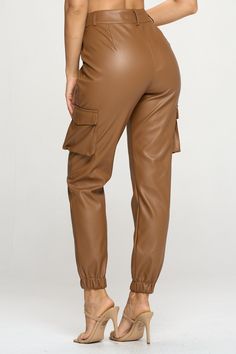 The perfect blend of trendy and practical. Constructed of PU material, these faux leather cargo pants combine dressy and casual elements, creating a look that’s both flattering and comfortable. Color: Camel - True to size with some stretch to the pant - Zipper & Button closure - Functional side flap pockets *Refer to size chart or contact us for any further questions. Leather Cargo Pants, Terry Cloth Romper, Leather Fits, Pleather Pants, Pants Large, Fall Shopping, Baggy Fits, Tight Leggings, Girls Night Out