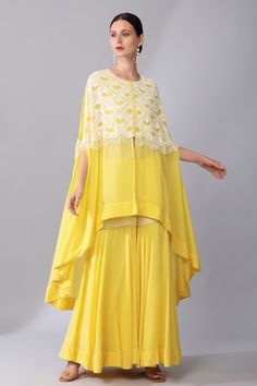 Yellow slit sleeves asymmetric cape with scallop embroidery using tonal sequins, glass beads highlights. Paired with a sharara. - Aza Fashions Sharara Outfits, Sharara For Women, Asymmetric Cape, Scallop Embroidery, Organza Embroidery, Women Kurta, Draping Fashion, Kurti Designs Party Wear, Yellow Silk