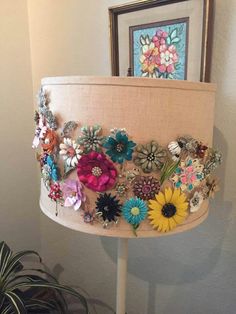 a lamp that has some flowers on it