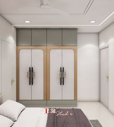 a white bed sitting in a bedroom next to two tall cupboards on the wall