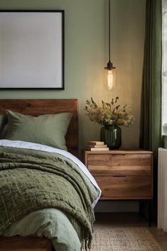 a bedroom with a bed, nightstands and a lamp on the wall above it