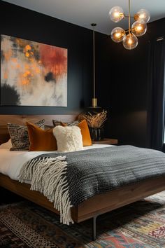 a bedroom with black walls and a large painting on the wall above the headboard