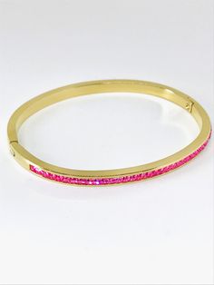 Introducing our 18K Gold Plated Bangle: sleek and elegant with AAA cubic pink zircon setting. Perfect for layering, it adds a touch of sparkle to your wrist. Wear solo or stack for a bolder statement. This stunning solid bangle bracelet is super trendy and stylish! It's comfortable and lightweight. Looks great stacked or on its own! - - - D E T A I L S - - - Oval shape bangle * THICK plating of 18k Gold over Stainless steel * AAA pink cubic zircon * Super high-quality & lightweight 15g * Size: Pink Bracelet Strap Jewelry For Formal Occasions, Pink Cubic Zirconia Bangle Bracelets, Pink Bracelet Style Jewelry For Formal Occasions, Formal Pink Jewelry With Bracelet Strap, Pink Bangle Bracelet For Formal Occasions, Pink Bracelets With Sparkling Stones, Pink Cubic Zirconia Crystal Bracelet As Gift, Pink Cubic Zirconia Bangle, Pink Gold Jubilee Bracelet As Gift