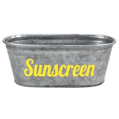 a metal tub with the word sunscreen painted on it's side in yellow