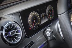 the dashboard of a car with speedometers and gauges