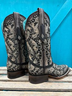 Exhibit your bold cowgirl style with Corral Women's Black Laser Embroidered & Studs Square Toe Cowgirl Boots, showcasing intricate embroidered detailing and studded accents. Authentic Cowgirl Style Cowhide Leather Vamp Pig Leather Lining Square Toe 12" Shaft Height Macocel 1.5" Cowboy Heel Leather Sole Goodyear Welt Construction Color: Black And Grey Embroidered Snip Toe Boots For Rodeo, Western Style Embroidered Boots, Western Hand Tooled Boots For Festivals, Western Embroidered Boots For Festivals, Hand Tooled Western Boots For Festival, Western Style Embroidered Boots For Festival, Western Style Embroidered Festival Boots, Embellished Festival Boots For Fall, Embroidered Snip Toe Boots For Festival