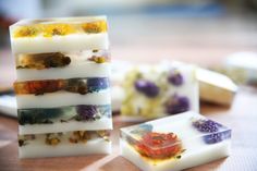 soap bars with flowers on them sitting on a table