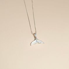 W H A L E ∙ T A I L ∙ P E N D A N T ∙ N E C K L A C E A chic whale tail shaped mother of pearl pendant on sterling silver chain. The whale tail is symbolic in many cultures with meanings of freedom, power, transformation, and connection to nature - while Mother-of-pearl is believed to attract prosperity and is often used in mystical work and lore to heighten intuition, psychic sensitivity and imagination. Mother-of-pearl is known for it's healing properties: Calmness, Protection from negative energy and Love. * Design: Sterling Silver Whale Tail Pendant Necklace * Material & Finish: Sterling Silver * Pendant: Mother of Pearl Whale Tail Pendant * Pendant Size (Approx.): 0.7 x 0.3in | 18 x 8mm ** Your necklace may vary slightly due to the uniqueness of the stone B I R TH S T O N E ∙ A N D ∙ Whale Tail Necklace, Mother Of Pearl Pendant, Pink Envelopes, Mother Of Pearl Necklace, Whale Tail, Shell Jewelry, Boho Gifts, Jewelry Boho, Mother Pearl