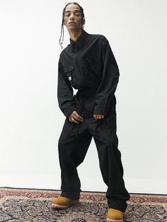 It is a trendy jumpsuit that is designed for streetwear and gorpcore style outfit. Made of nylon fabric, the jumpsuit is durable, comfy, and refreshing. The washed nylon fabric creates sophisticated look. The jumpsuit has drawstrings on the waist and drawcords on the hem for adjustment.- Zip closure- Collar neck- Side pockets - Flap pockets- Label patch Black Relaxed Fit Jumpsuits And Rompers With Side Pockets, Utility Relaxed Fit Jumpsuits With Cargo Pockets, Black Cotton Jumpsuits And Rompers For Streetwear, Black Overall Jumpsuits And Rompers For Streetwear, Black Overall Jumpsuit For Streetwear, Relaxed Fit Overall Jumpsuits For Streetwear, Relaxed Fit Streetwear Overalls, Casual Long Sleeve Jumpsuit With Cargo Pockets, Oversized Jumpsuit