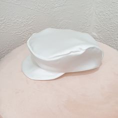 Introducing our exquisite Baby Newsboy Cap, the perfect accessory for any special event, be it a Christening, Baptism, or Blessing. This charming and sophisticated hat will make your little one look absolutely adorable and distinguished. Handmade with love, each cap is crafted from luxurious silk, one of the world's most opulent textiles. The cap not only enhances the noble and elegant nature of baptismal attire but also creates a timeless keepsake to remember this momentous occasion. ☑ Why Choo White Adjustable Hat For Baptism, White Bonnet Gift, One Size Fits Most, Elegant White Flat Cap, White Bonnet Gift (one Size Fits Most), White Bonnet, One Size Fits Most, Gift, Hat For Boys, Beret Style, Flat Hat, Baby Boy Baptism