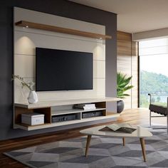 a living room with a large flat screen tv mounted to the side of a wall