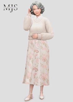 a woman in a white sweater and floral skirt with her hand up to the side