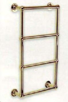 an antique brass towel rack with three bars