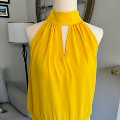 *Nwt* Tulip Yellow Razorback Sleeveless Blouse -Size S -Halter Style -Three (3) Covered Buttons In Back Chic Yellow Halter Top For Spring, Fitted Mustard Sleeveless Top, Mustard Fitted Sleeveless Top, Mustard Sleeveless Tank Top For Summer, Yellow Sleeveless Blouse Tank Top For Spring, Yellow Sleeveless Blouse For Spring, Sleeveless Mustard Tops For Spring, Yellow Sleeveless Tank Top, Yellow Sleeveless Spring Blouse