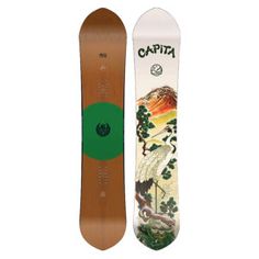 a snowboard with the words capita on it and an image of a mountain