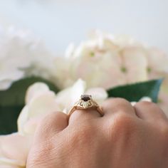 Four leaves in yellow and rose gold set the center of this 10k yellow gold ring. A deep red emerald cut garnet is set between the leaves and creates a nature motif for this lovely vintage ring. Metal: 10K Yellow and Rose Gold Garnet: 6.8 x 4.8 MM Band Width: 17.5 MM @ Widest Size: 7 For a greater selection of jewelry please visit our website at www.BlackMarketLLC.com If you have any questions about this product or if we can help you with any of our other products please contact us through Etsy o Heirloom Emerald Cut Ruby Promise Ring, Heirloom Emerald Cut Ruby Ring Gift, Heirloom Emerald-cut Ruby Ring, Heirloom Emerald Cut Birthstone Ring, Aqua Ring, Nature Motifs, Garnet Gem, Vintage Diamond Rings, Alternative Engagement Rings