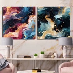 two paintings on the wall in a living room