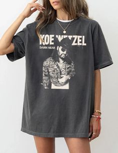 Koe Wetzel Vintage 90s Shirt, Koe Wetzel 2024 Concert Tee, Koe Wetzel Country Music Album Tee, Koe Wetzel Tour Shirt The unisex heavy cotton tee is the basic staple of any wardrobe. It is the foundation upon which casual fashion grows. All it needs is a personalized design to elevate things to profitability. The specially spun fibers provide a smooth surface for premium printing vividness and sharpness. No side seams mean there are no itchy interruptions under the arms. The shoulders have tape f Post Malone Shirt, Rapper Shirts, Western Graphic Tees, 90s Shirts, Festival Shirts, Country Shirts, Concert Shirts, Concert Tees, Post Malone