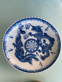 a blue and white plate sitting on top of a table