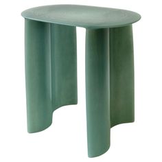 a small green table with curved legs