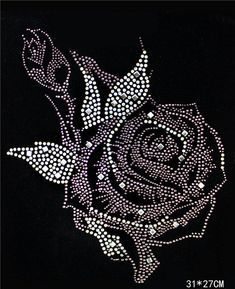 a black rose with white dots on it