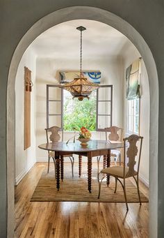 an archway leads into the dining room