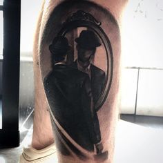 a man's leg with a black and white photo on it