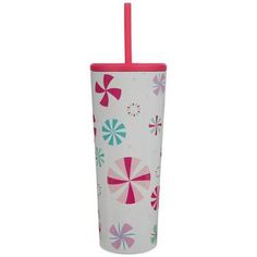 a pink and green cup with a straw sticking out of it's side, on a white background