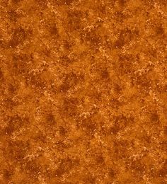 an orange background with some brown spots on it