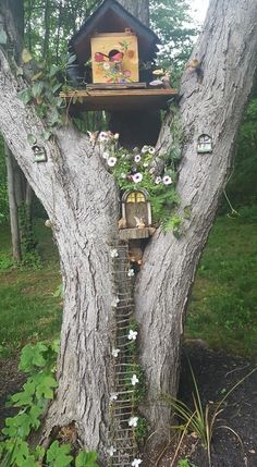 a bird house built into the side of a tree