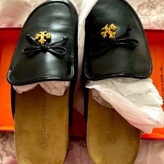 New Tori Burch Black Charm Mules. So Very Comfortable. Nib With Packing And Protection Bag With Matching Charm. Suede Insole. Tory Burch Slides, Black Flat Leather Shoes, Tori Burch, Tory Burch Eleanor, Tory Burch Ballet Flats, Black Leather Ballet Flats, Protection Bag, Metallic Flats, Tory Burch Sandals