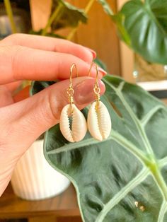 Check out our handmade wire wrapped puka shell earrings! Hypoallergenic and anti-tarnish, these earrings are the perfect acessory for summer. Click on our link to explore more of our unique, handmade wire jewelry. Beachy Everyday Summer Jewelry, Summer Beachy Cowrie Shell Jewelry, Beachy Cowrie Shell Jewelry For Summer, Summer Beach Dangle Jewelry, White Shell-shaped Earrings For Vacation, Handmade Summer Earrings For Vacation, Vacation Shell-shaped Earrings With Ear Wire, Beach Jewelry For Pierced Ears, Shell-shaped, Summer Shell Jewelry For Gifts