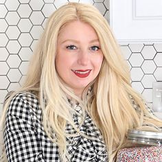 a woman with long blonde hair holding a jar