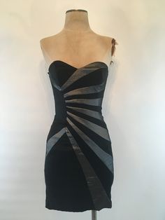 "Strapless Caché dress with sunburst grey/black fabric has a silk sharkskin appearance, sweetheart neckline and zips up in the back with boning on each side of the bodice. Dress is fully lined in black satin and is stretchy and made with a mid weight fabric that looks rich. In excellent vintage condition. Made by Cache, there are no fabric content tags, Bust up to 34\" Waist 24\", up to 26.5\" Hips 32\", up to 36\" Length 27\" Vintage garments have been previously worn and lovingly cared for, th Fitted Knee-length Strapless Dress With Lining, Fitted Strapless Dress With Sweetheart Neckline And Back Zipper, Fitted Strapless Dress With Sweetheart Neckline And Lining, Knee-length Lined Strapless Party Dress, Lined Bodycon Dress With Fitted Bodice For Night Out, Fitted Lined Strapless Evening Dress, Fitted Lined Strapless Dress For Evening, Lined Bodycon Dress With Fitted Bodice For Evening, Strapless Lined Bodycon Dress For Night Out