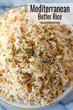 a white plate topped with rice covered in herbs