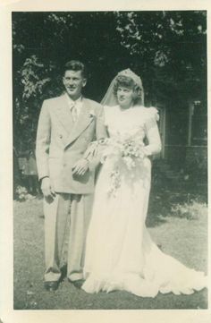 an old black and white photo of a bride and groom