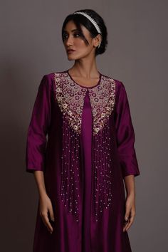 Purple A-line tunic with floral pearl and thread embroidery on the yoke. Paired with an inner. - Aza Fashions Designer Embroidered Raw Silk Dress, Elegant Dresses With Dori Work For Transitional Season, Festive Raw Silk Embroidered Dress, Festive Resham Embroidered Tunic Top, Transitional Festive Kurta With Pearl Embroidery, Elegant Embroidered Straight Kurta Tunic, Festive Straight Kurta Dress With Pearl Embroidery, Festive Straight Kurta With Pearl Embroidery, Festive Designer Embroidered Tunic