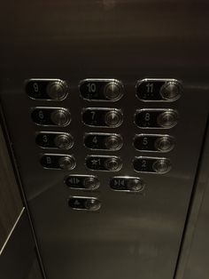 an elevator with buttons and numbers on it