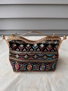 The fabric is needlework. It's got 2 pockets inside. Can be used as hand bag and shoulder bag. Dry laundry only. Brand-new. Stylish and unique. Shoulder strap is removable. Rectangular Bag With Multicolor Embroidery For Evening, Evening Rectangular Shoulder Bag With Multicolor Embroidery, Rectangular Evening Bag With Multicolor Embroidery, Evening Embroidered Multicolor Shoulder Bag, Embroidered Multicolor Evening Shoulder Bag, Evening Bag With Multicolor Embroidery, Rectangular Multicolor Embroidered Evening Bag, Multicolor Embroidered Shoulder Satchel, Multicolor Embroidered Satchel Shoulder Bag