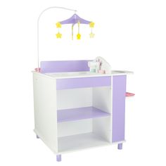 a purple and white baby crib with an umbrella on it's top shelf