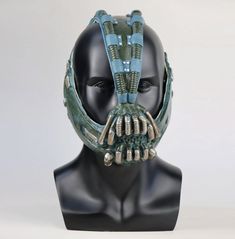 a batman mask with spikes on it's face is shown in front of a white background