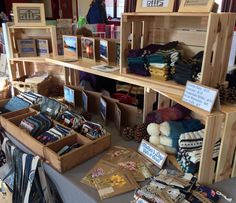 the table is covered with many items for sale