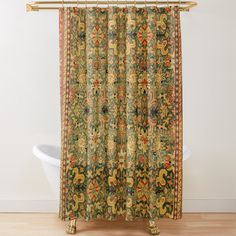 an ornately decorated shower curtain in a bathroom