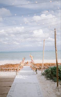 an outdoor wedding setup on the beach