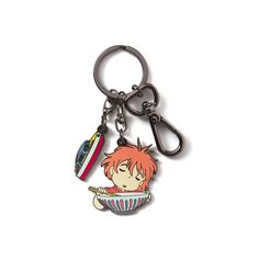 a keychain with an anime character holding a toothbrush in it's mouth