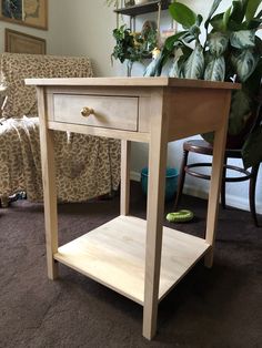 a small wooden table with one drawer on top