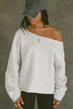 Oversized, off-the-shoulder pullover with a wide neckline and raw hem. Custom knit french terry fabric Brushed mid-weight cotton - ideal for layering Soft, comfortable and made to last Color: Pearl Grey French Terry Sizing: S/M (0-4), M/L (6-10) Model is 5'8" and wearing size S/M Fabric: 98% Cotton, 2% Polyester Care: Machine Wash Cold With Like Colors.Care: Tumble Dry Low. JOAH BROWN | MADE IN LOS ANGELES Oversized Off-shoulder Loungewear Top, Fall Drop Shoulder Top For Lounging, Oversized Off-shoulder Cotton Top, Casual Off-shoulder Sweater For Loungewear, Joah Brown, Terry Fabric, French Terry Fabric, Pearl Grey, Crop Sweatshirt